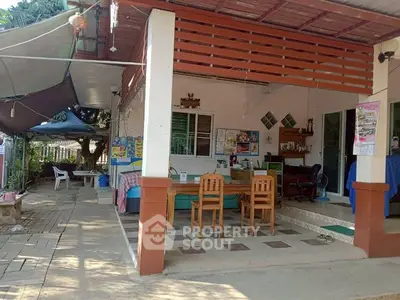 Charming outdoor patio with dining area and garden view