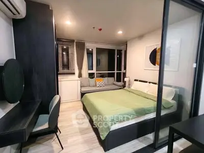 Modern bedroom with stylish decor and cozy seating area