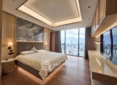 Luxurious bedroom with stunning city view and modern design in high-rise apartment.