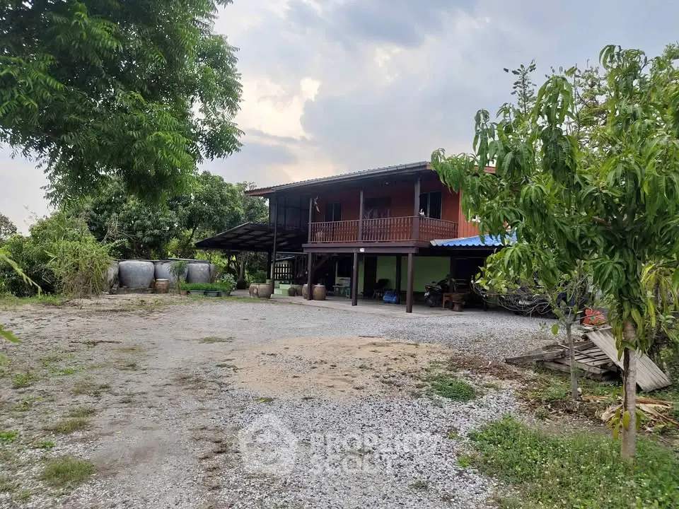 Charming rural property with spacious yard and traditional architecture, perfect for serene living.