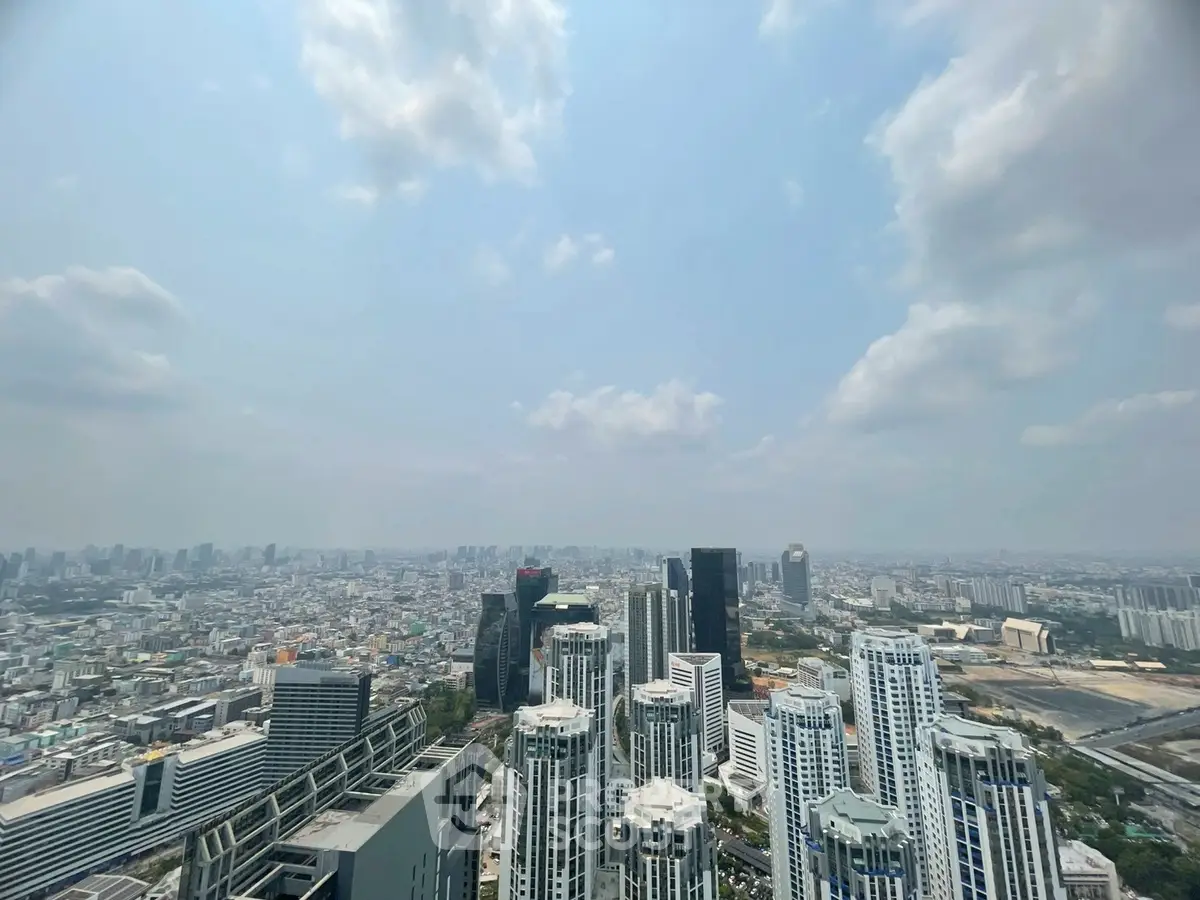 Stunning cityscape view from a high-rise building showcasing urban skyline and modern architecture.