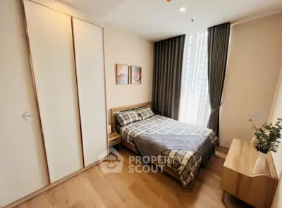 Cozy bedroom with modern decor and ample natural light