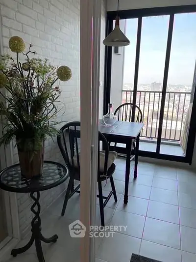 Charming balcony with city view, stylish seating, and elegant decor for a perfect urban retreat.