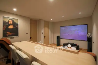 Modern living room with home theater setup and stylish decor