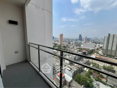 Stunning cityscape view from modern high-rise balcony, perfect for urban living.