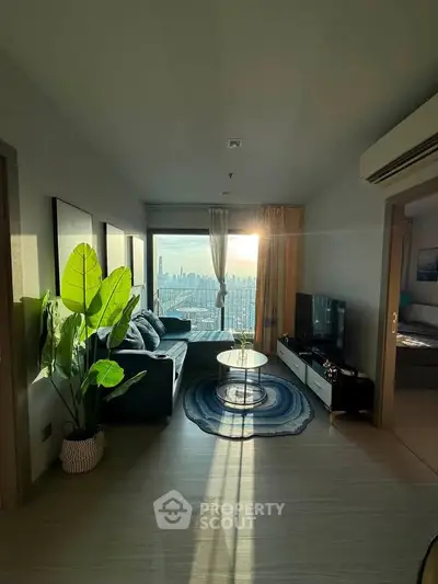 Modern living room with stunning city view, stylish decor, and abundant natural light.