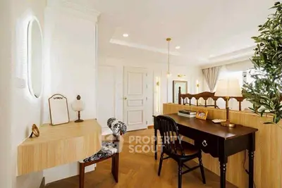 Elegant study room with stylish wooden furniture and warm lighting, perfect for productivity and relaxation.