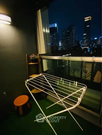 Charming balcony with city skyline view, perfect for relaxing evenings.
