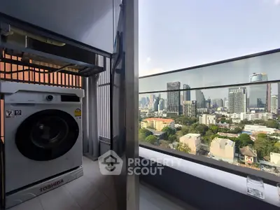 Stunning city view from a modern balcony with a washing machine setup.