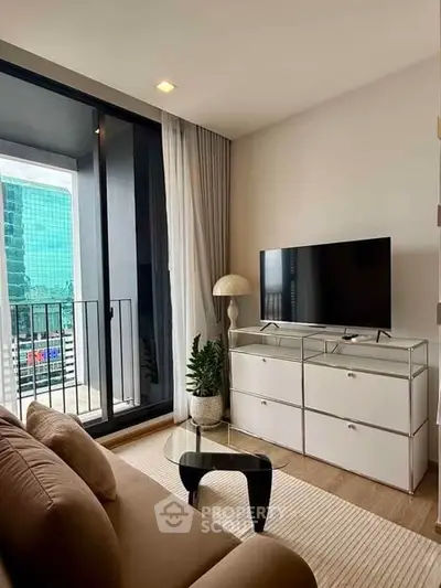 Modern living room with sleek furniture and balcony view in urban apartment.