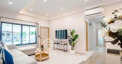 Modern living room with sleek design, large windows, and stylish decor