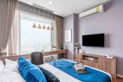 Modern bedroom with city view, stylish decor, and cozy ambiance
