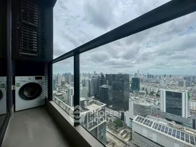 Stunning high-rise balcony view with city skyline and modern amenities.