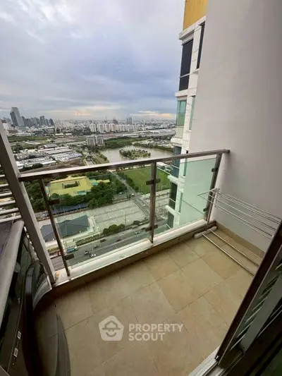 Stunning high-rise balcony with panoramic city view, perfect for urban living.