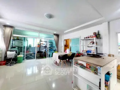 Spacious living room with modern decor and sliding glass doors