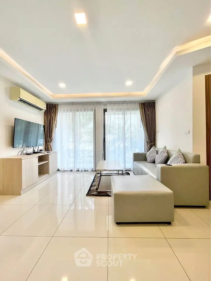 Spacious modern living room with sleek design and natural light
