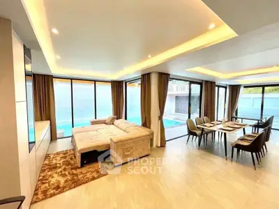 Luxurious open-plan living room with pool view and elegant dining area