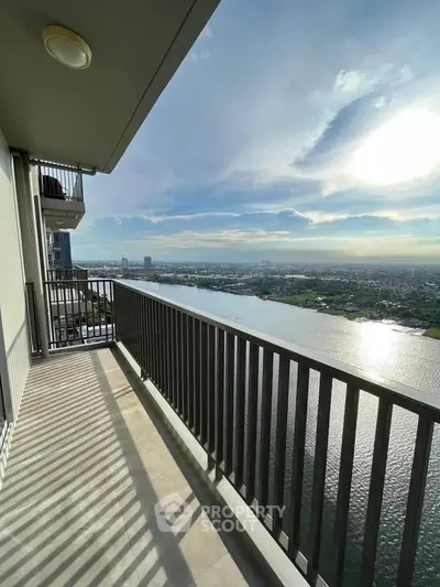 Stunning river view from high-rise balcony with expansive skyline.