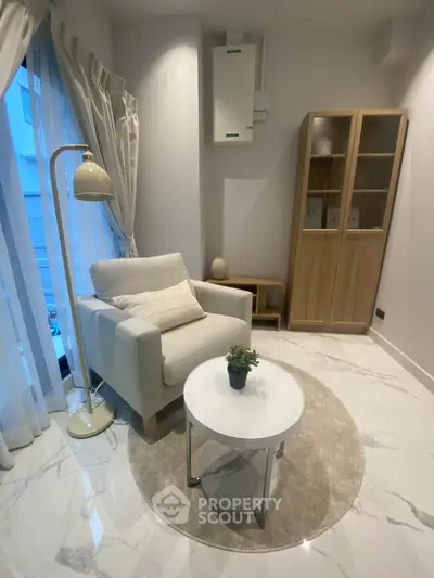 Cozy modern living room with elegant armchair and stylish decor