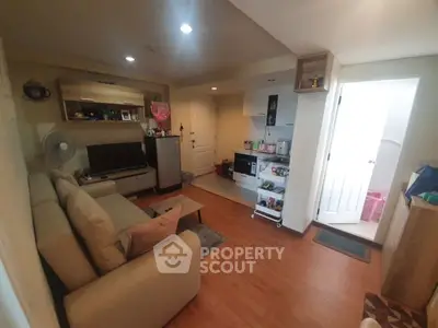 Cozy living room with open kitchen layout and modern decor
