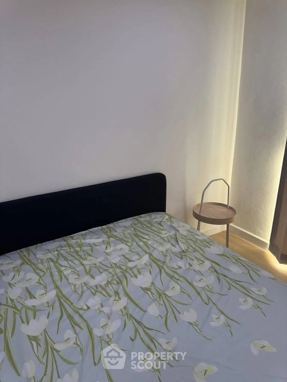 Cozy bedroom with floral bedding and minimalist decor