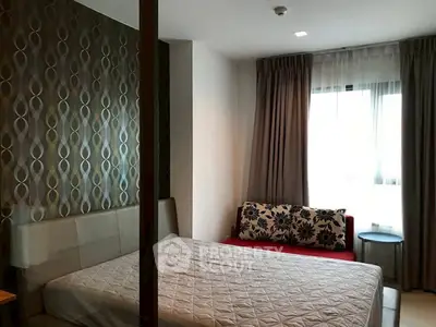 Cozy bedroom with modern decor and ample natural light