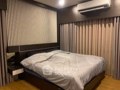 Modern bedroom with stylish decor and air conditioning