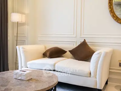 Elegant living room with plush white sofa and stylish decor