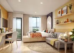 Modern studio apartment with stylish decor, featuring a cozy bed, sofa, and workspace, ideal for urban living.