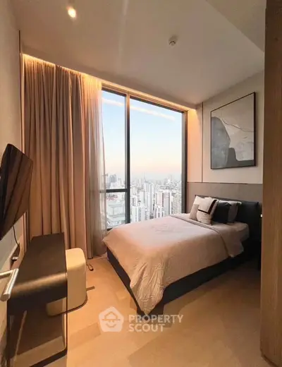 Luxurious bedroom with stunning city view, modern decor, and floor-to-ceiling windows in high-rise apartment.