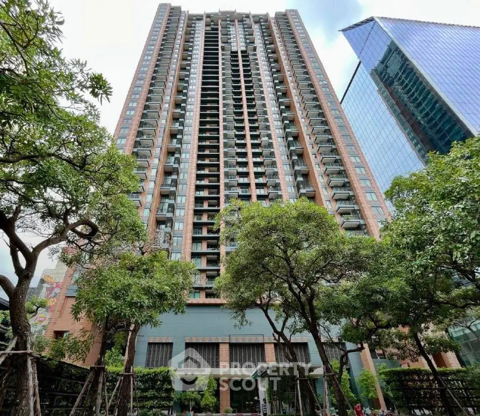 Stunning high-rise building with lush greenery and modern architecture.
