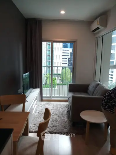 Modern living room with balcony view in urban apartment