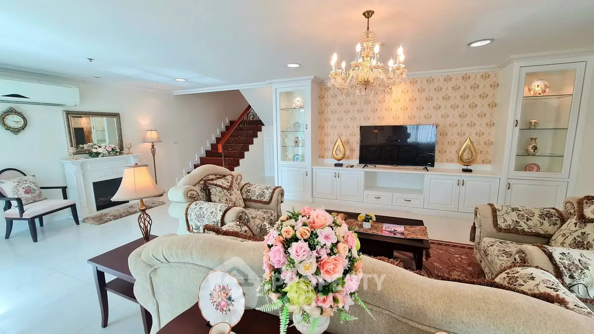 Luxurious living room with elegant chandelier and classic decor