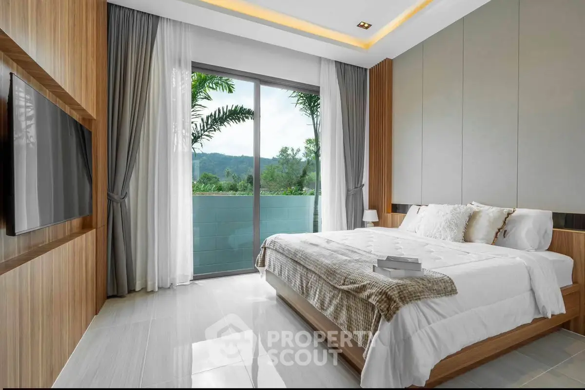 Luxurious bedroom with large window and scenic view, featuring modern decor and cozy bedding.