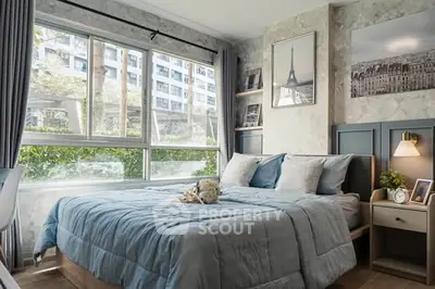 Chic bedroom with large window and stylish decor in modern apartment