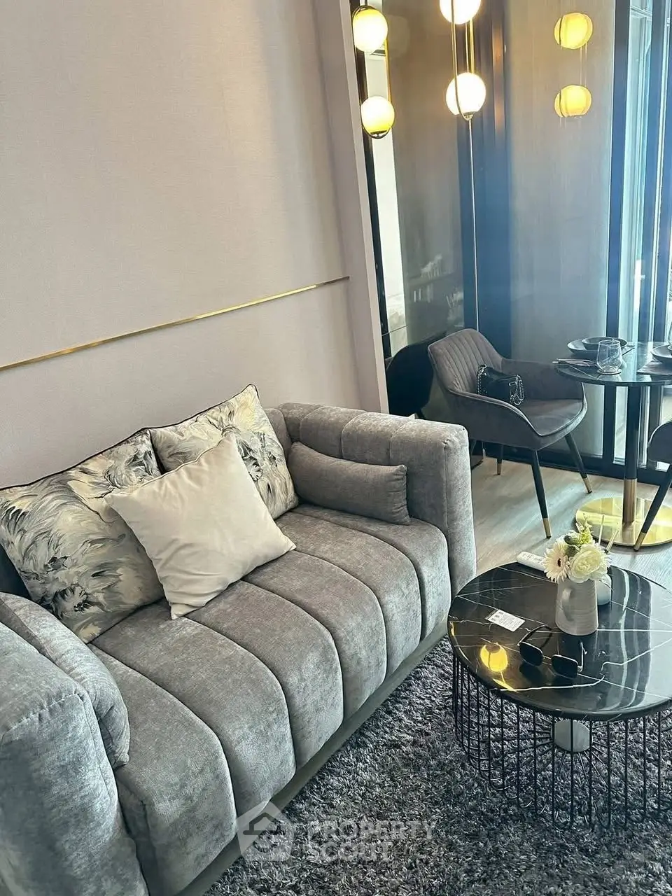 Stylish modern living room with plush gray sofa and chic decor