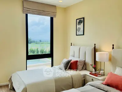 Elegant bedroom with twin beds, large window view, and stylish decor in a modern home.