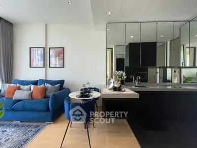 Modern open-plan living room with stylish kitchen and cozy seating area