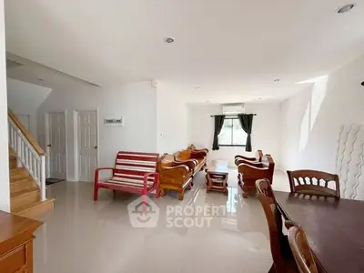 Spacious living room with elegant wooden furniture and natural light