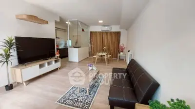 Modern living room with sleek furniture and open layout, perfect for contemporary living.