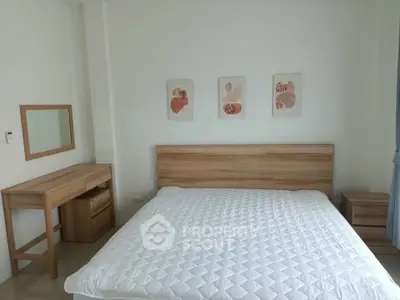 Modern bedroom with minimalist wooden furniture and stylish wall art