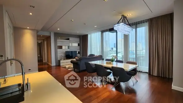 Luxurious modern living room with city view, elegant dining area, and sleek kitchen design.