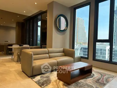 Luxurious modern living room with city view, featuring elegant leather sofa and stylish decor.