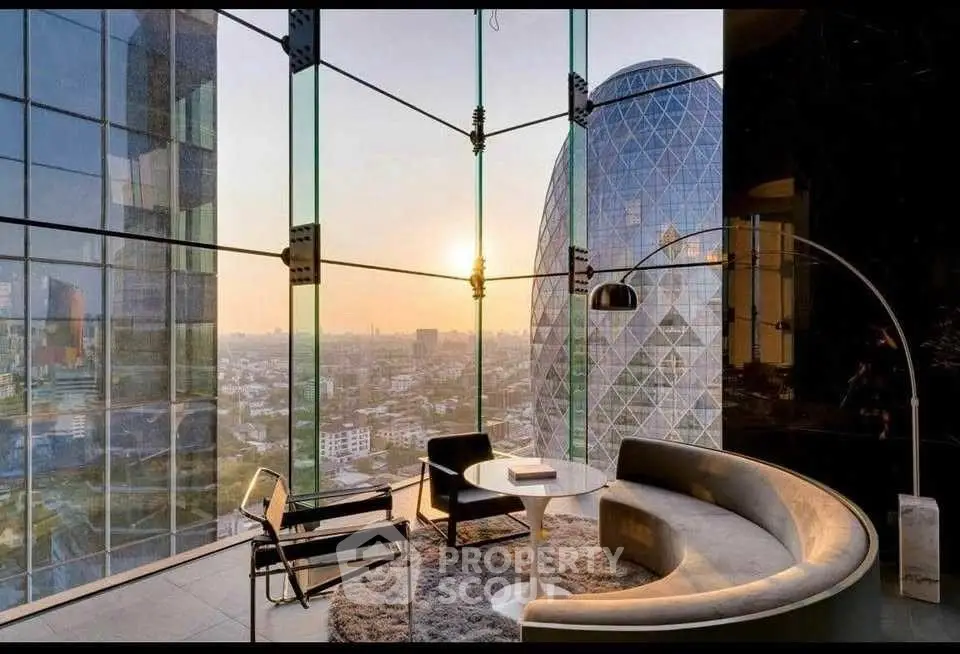 Luxurious modern living room with panoramic city view and stylish furniture.
