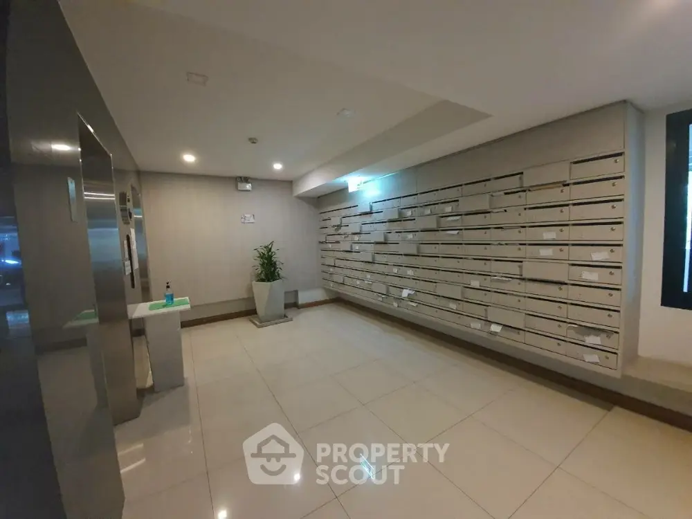 Modern apartment building entrance with mailboxes and sleek design