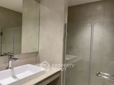 Modern bathroom with sleek design and glass shower enclosure