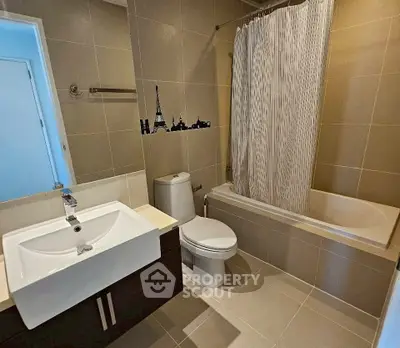 Modern bathroom with elegant fixtures and a stylish bathtub in a contemporary apartment.