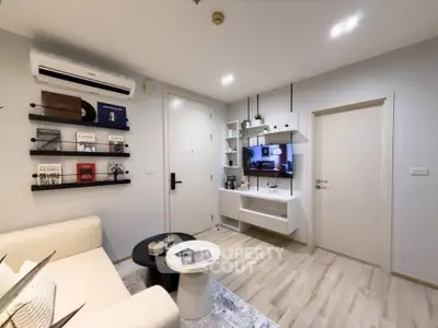 Modern living room with stylish decor and wall-mounted shelves