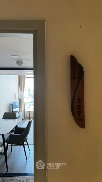 Modern apartment entrance with stylish interior and city view