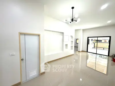 Spacious modern living room with sleek tile flooring and stylish lighting
